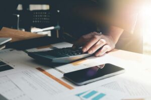 A person using a calculator