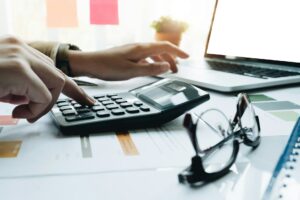 A person using a calculator